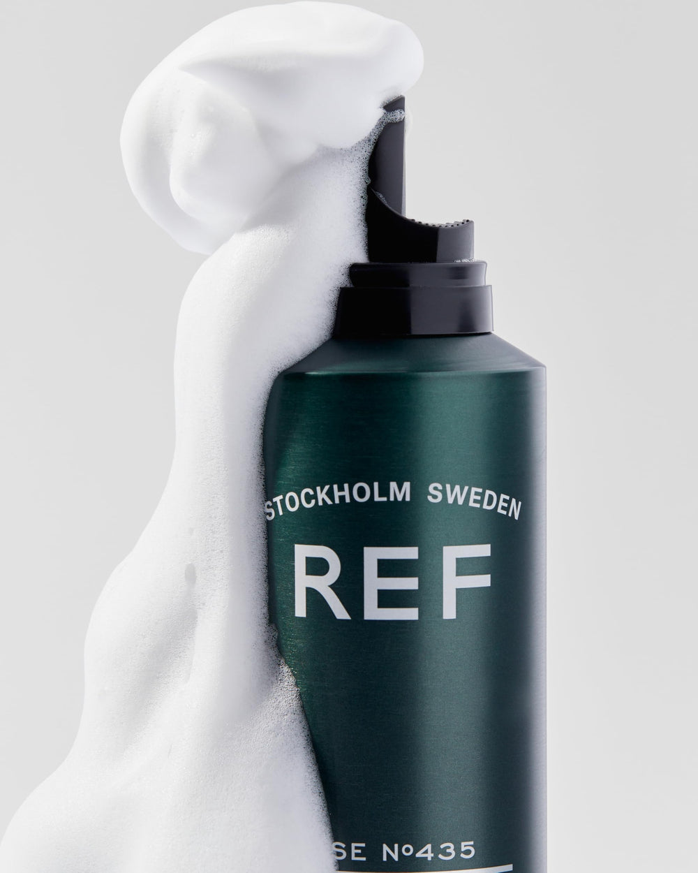 REF mousse on bathroom shelf in styled setting suggesting everyday professional styling benefit