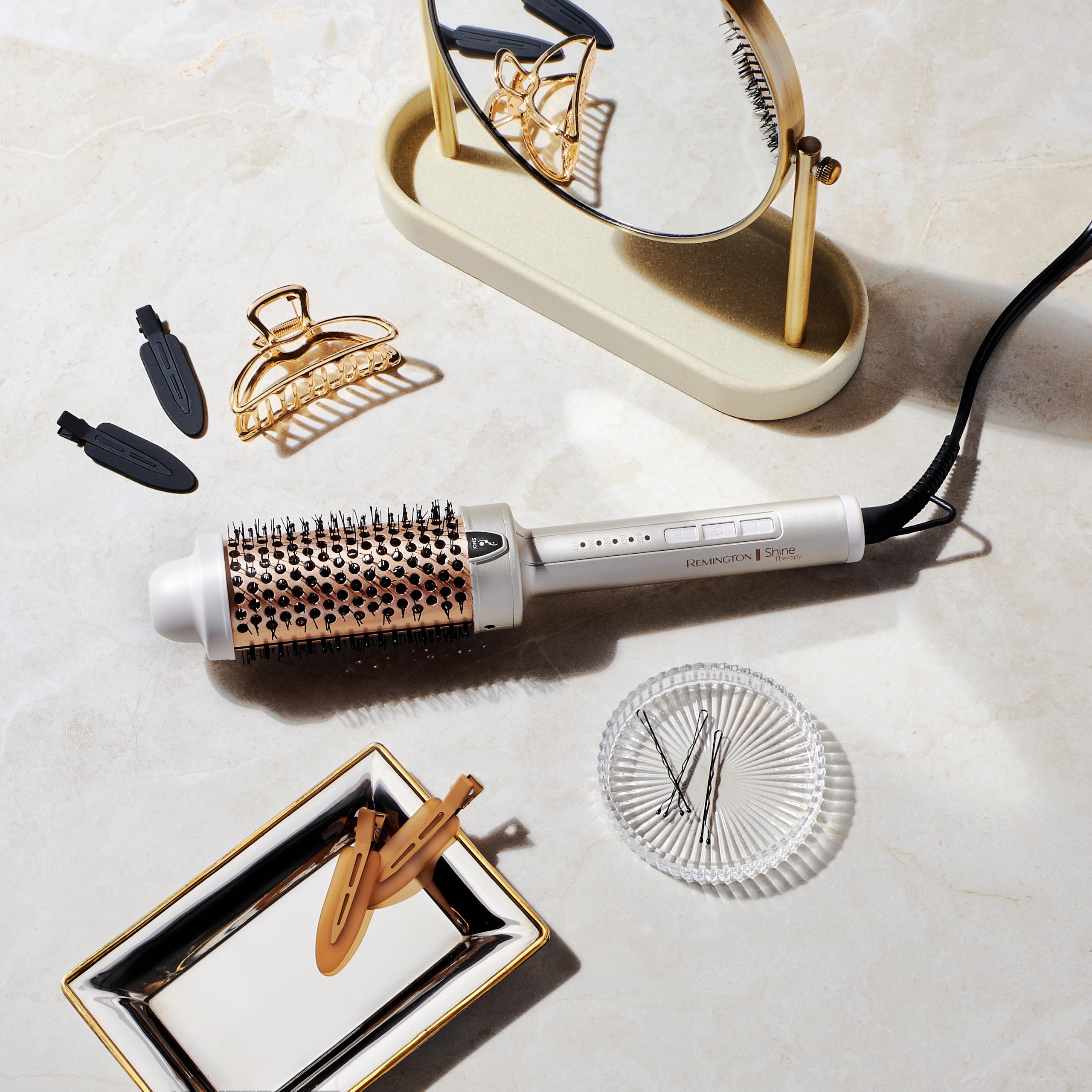 Remington brush beside common items to show size and included safety features