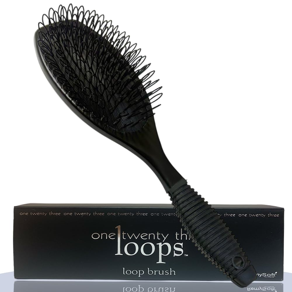 RemySoft brush front view showing loop bristles and cushioned pad for gentle detangling