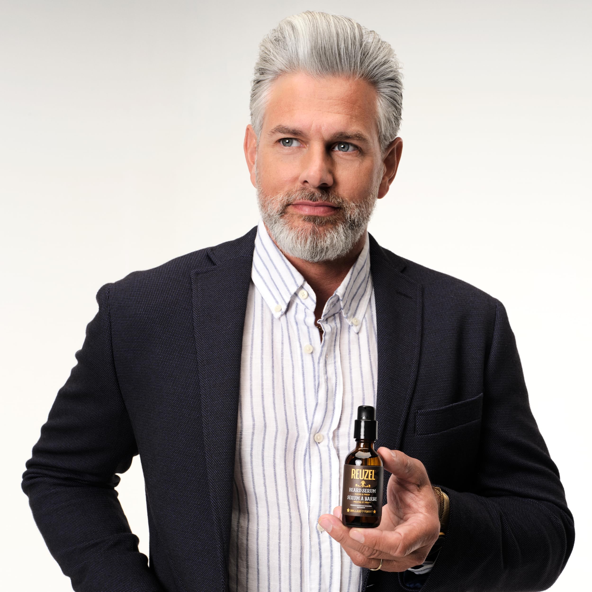 REUZEL styled on bathroom shelf illustrating everyday grooming use