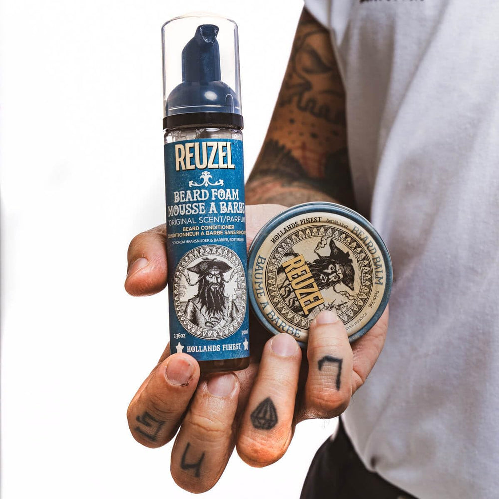 Reuzel beard balm being warmed on palms before application for smooth grooming