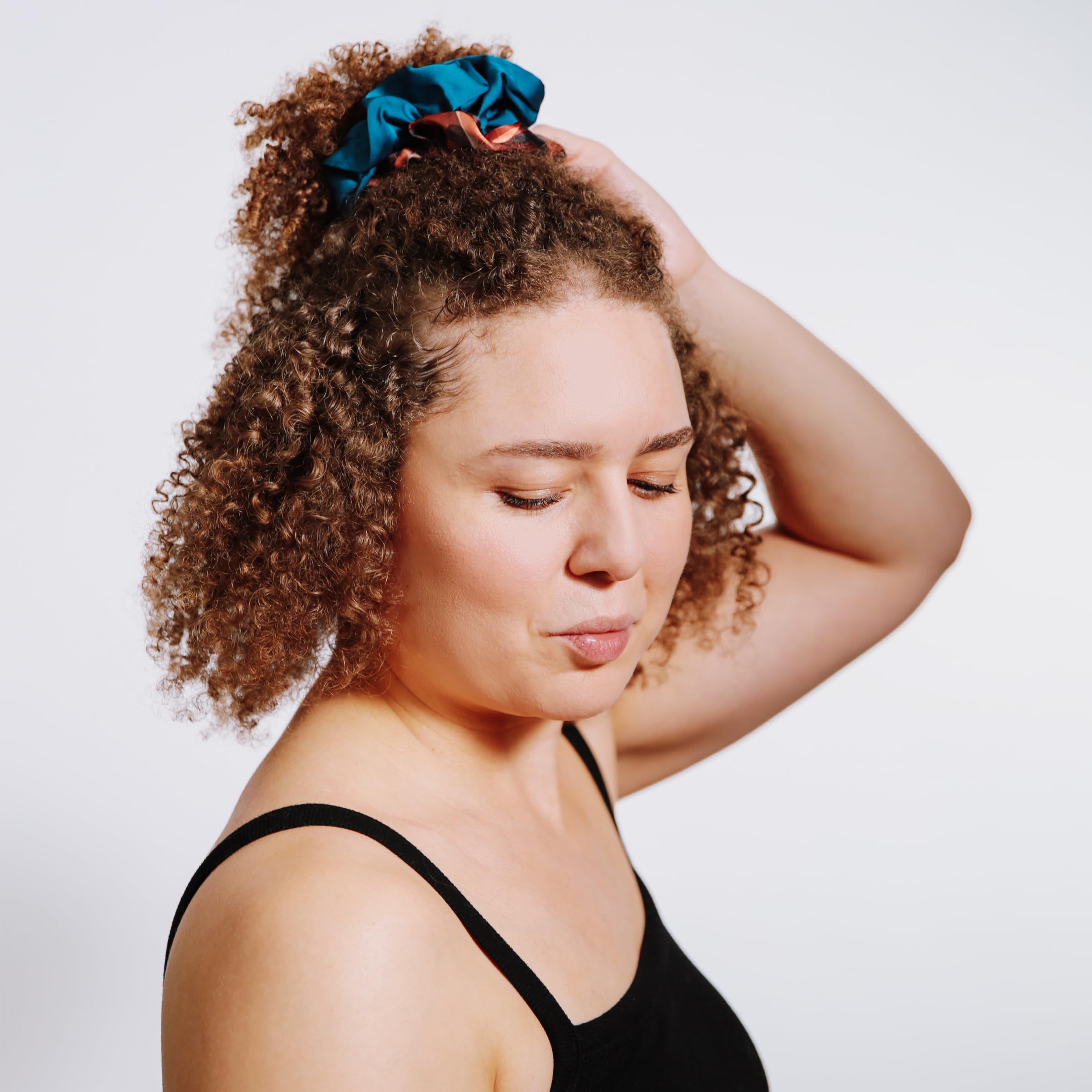 REVAIR Cinnamon Swirl styled bun in lifestyle scene showing everyday wearability benefit