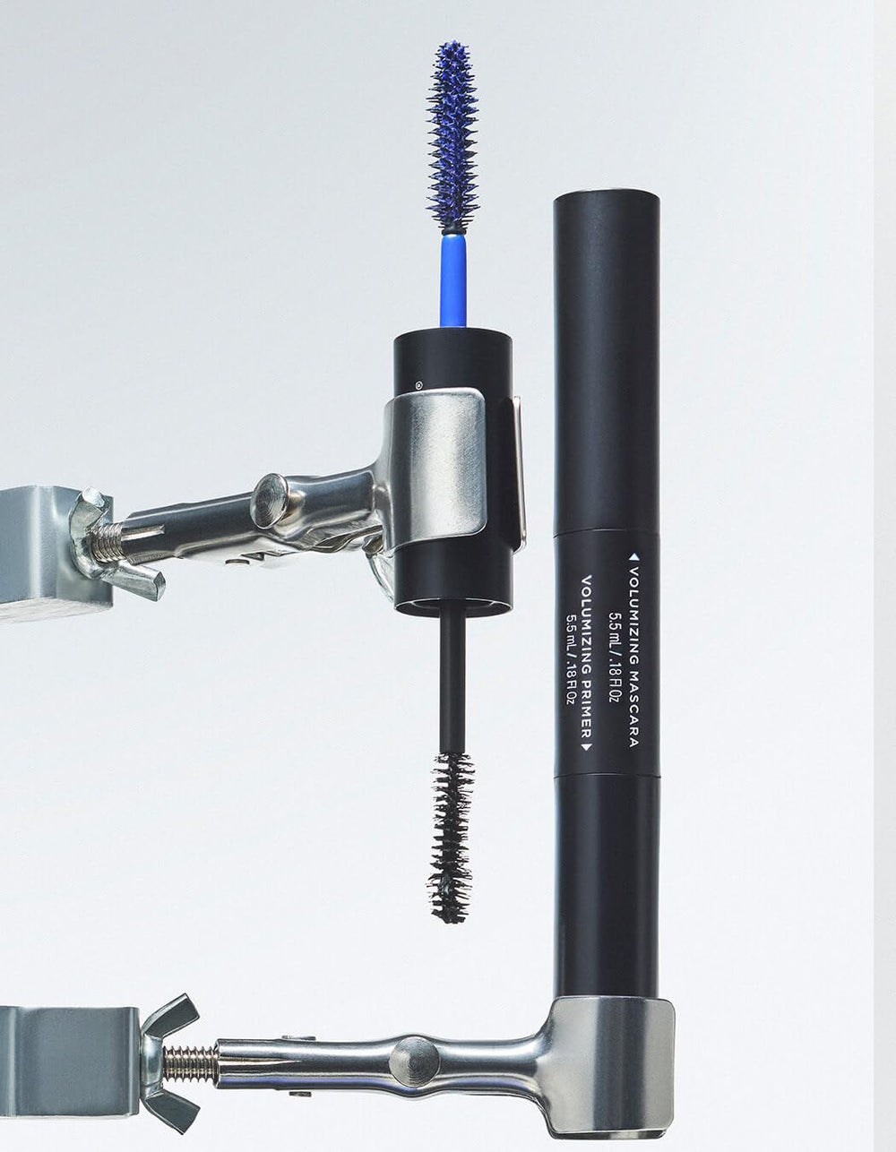 RevitaLash dual-ended tube beside a ruler showing compact size