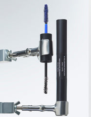 RevitaLash dual-ended tube beside a ruler showing compact size