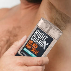 Right Guard 4 oz tube held in hand to show size and travel convenience