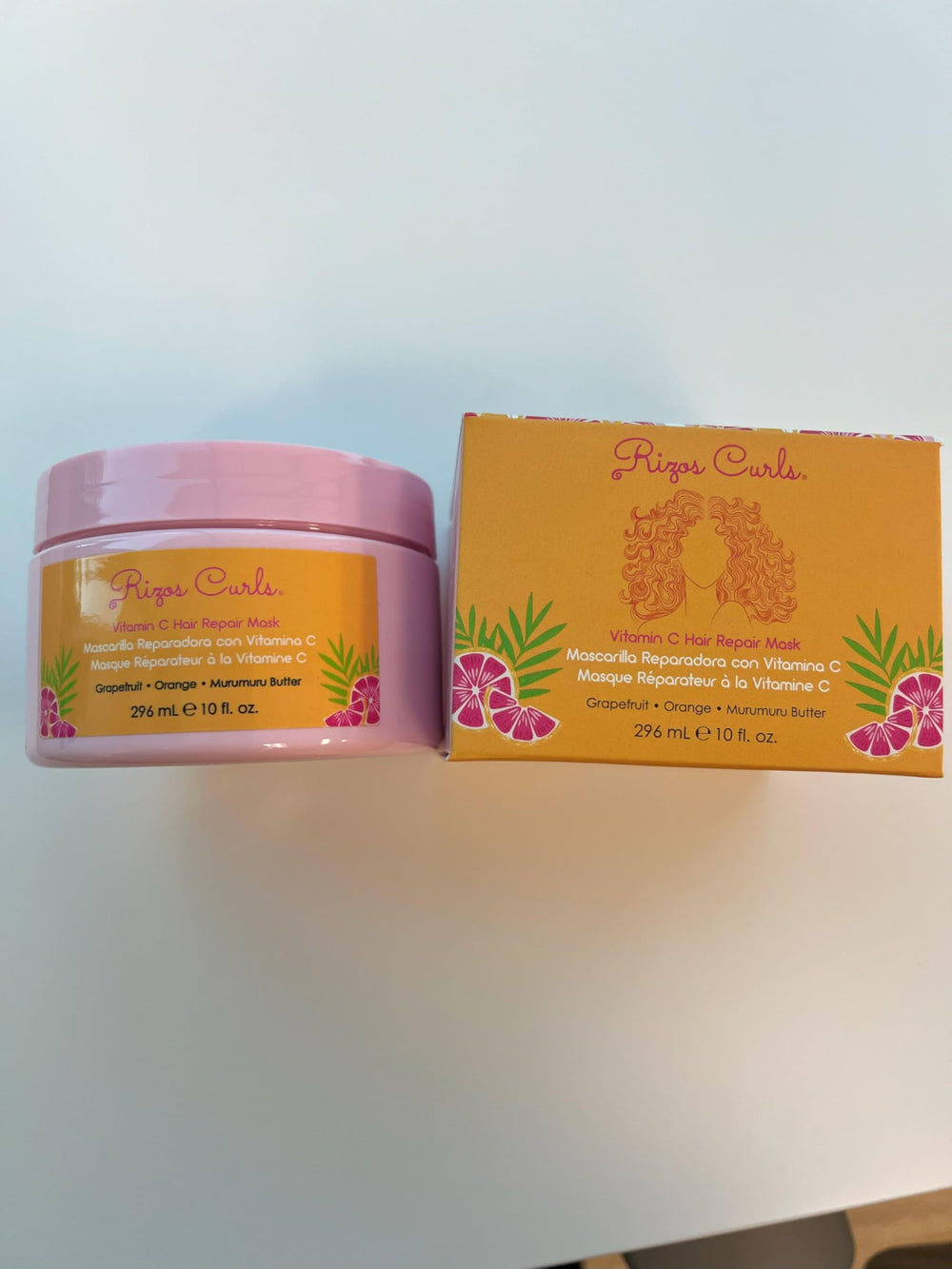 Rizos Curls with citrus and butter ingredients illustrating nourishing components