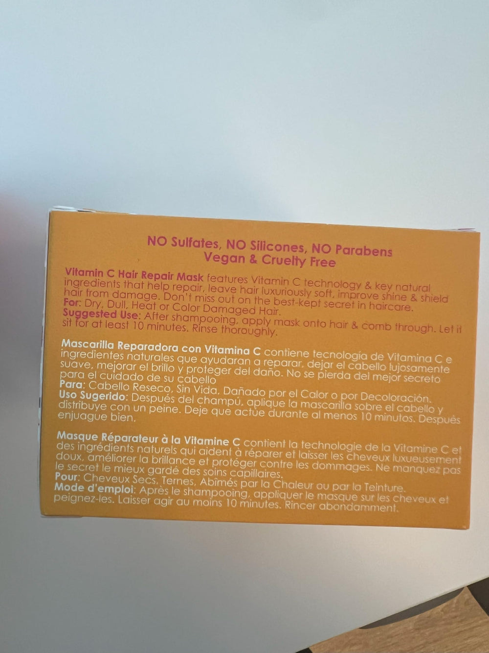 Rizos Curls ingredients label close-up showing vitamin C, butters and oils for clarity