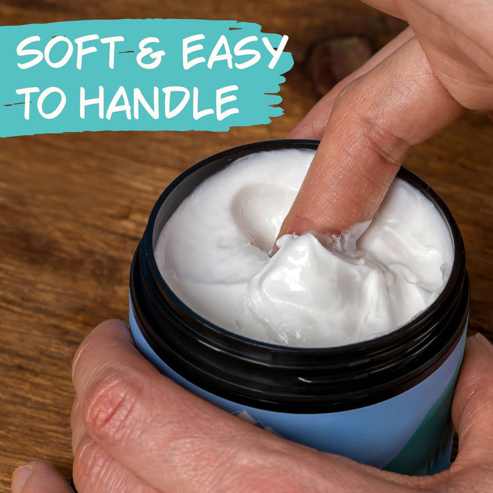 Rocky Mountain Barber Company tub beside hand to show 4 oz size and long-lasting use