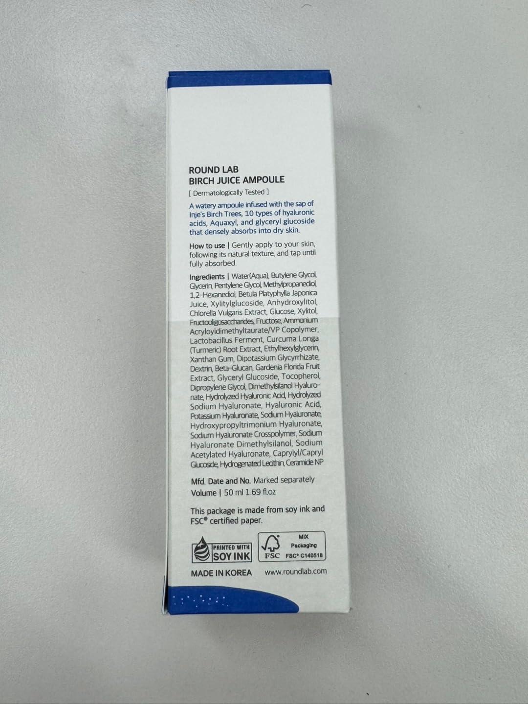 ROUND LAB bottle beside a ruler showing the 1.69 fl oz scale benefit