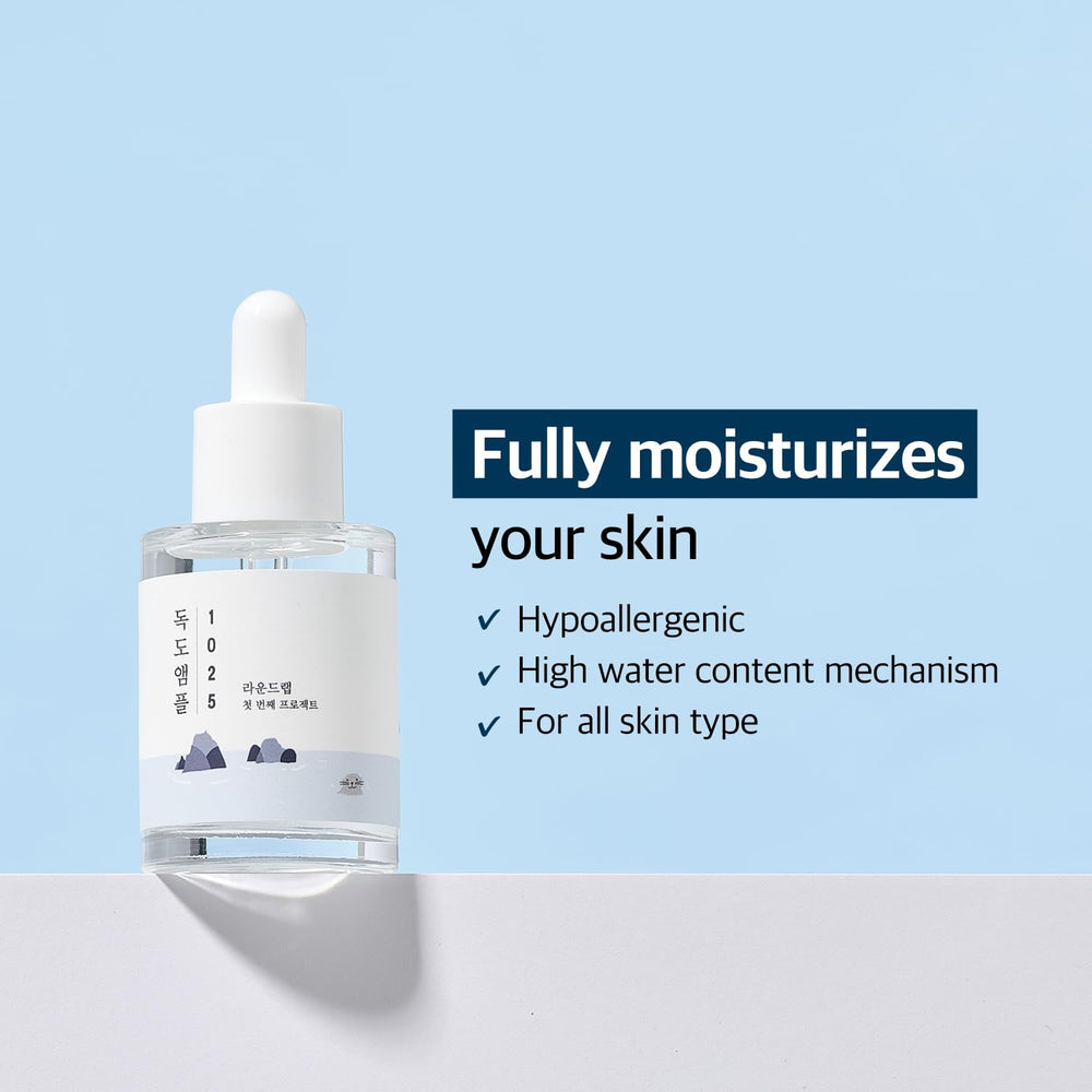 ROUND LAB dropper close-up dispensing a clear hydrating drop for quick absorption