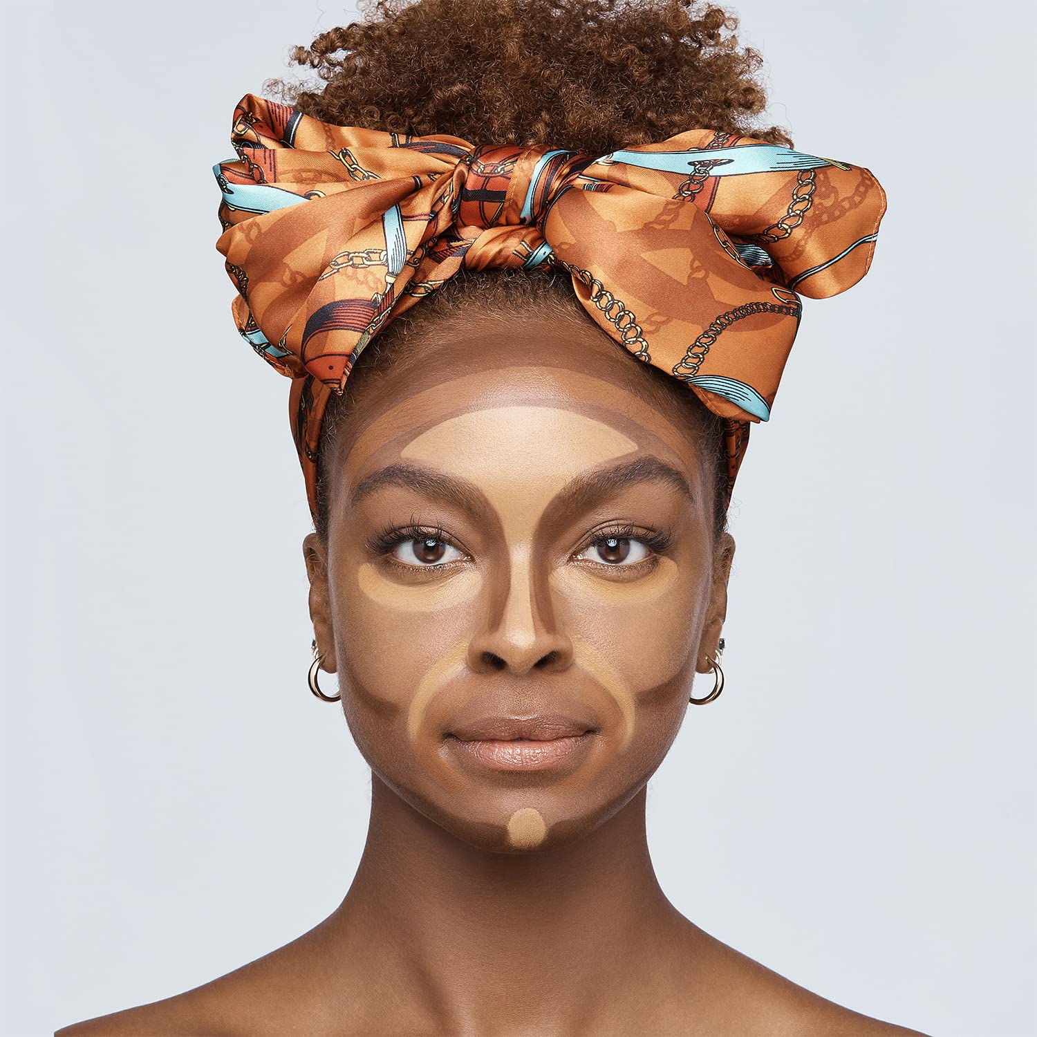 Ruby Kisses applying contour with brush to demonstrate quick sculpting benefit