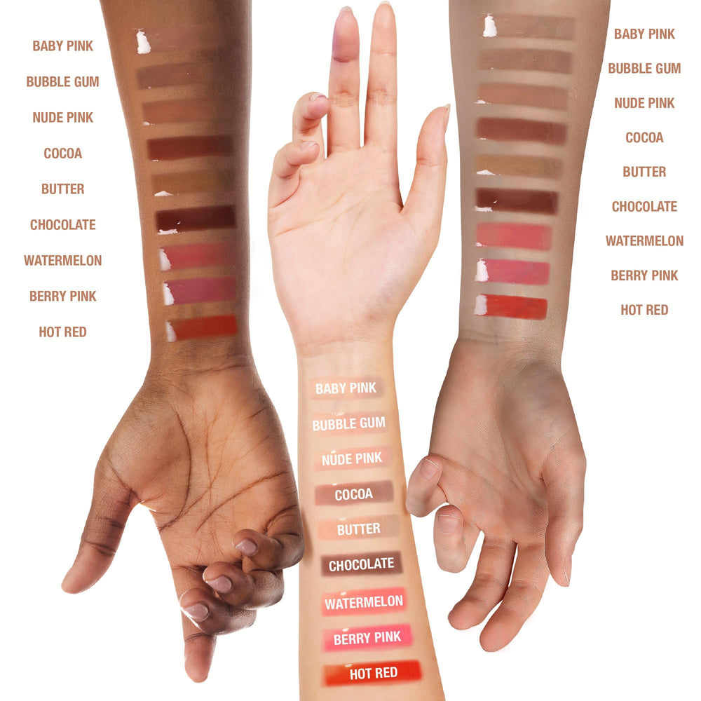 Ruby Kisses gloss swatches on arm illustrating shades and buildable pigment