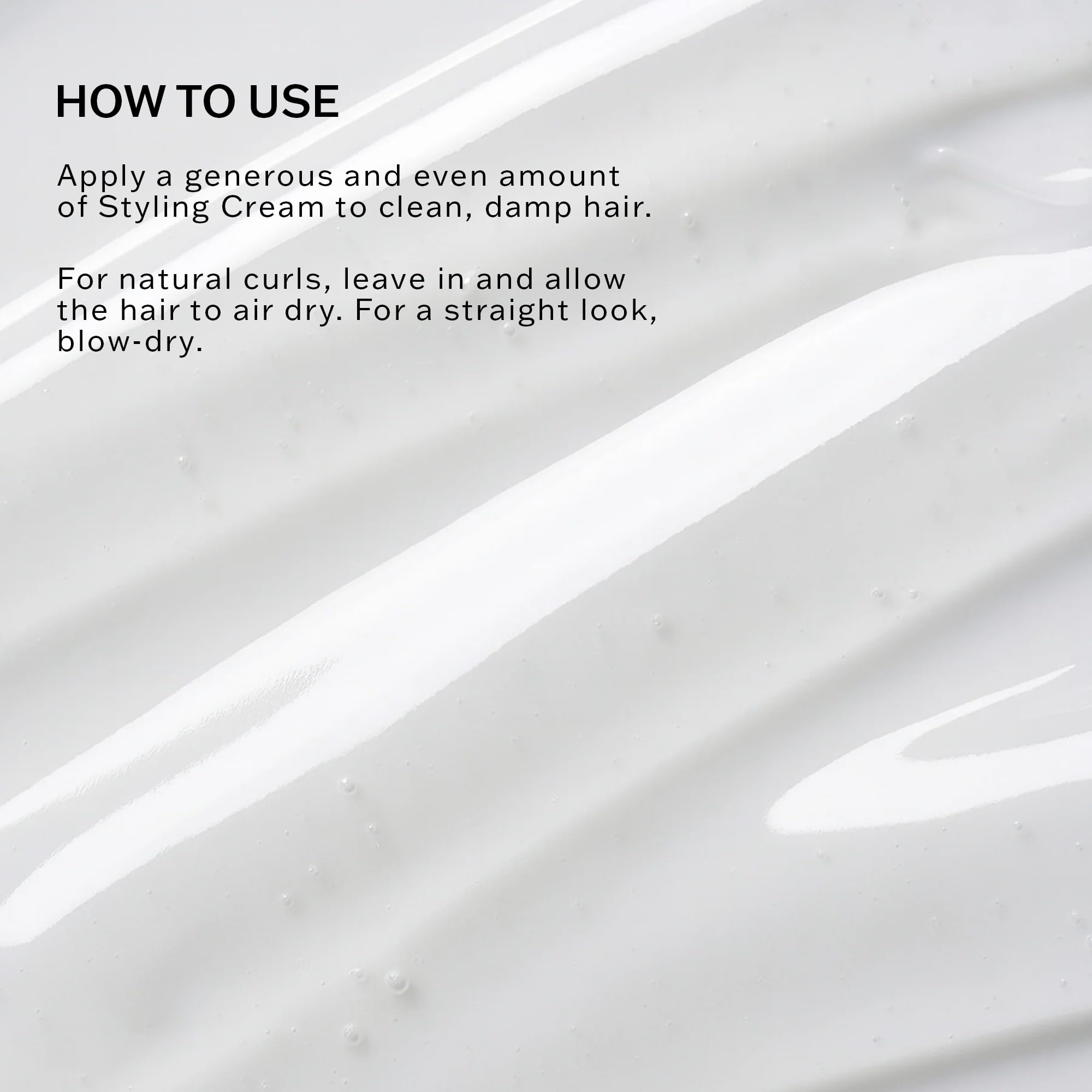 SACHAJUAN cream being applied to damp hair to define curls and reduce frizz