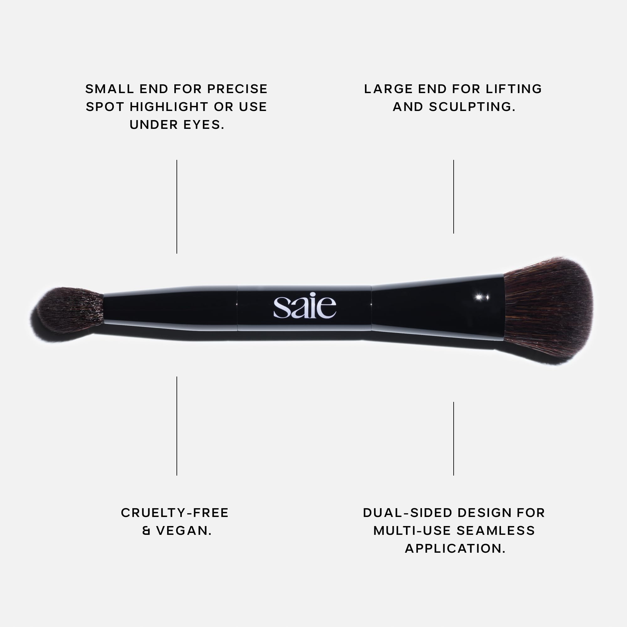 Saie brush in use applying cream highlighter to cheekbone for seamless glow