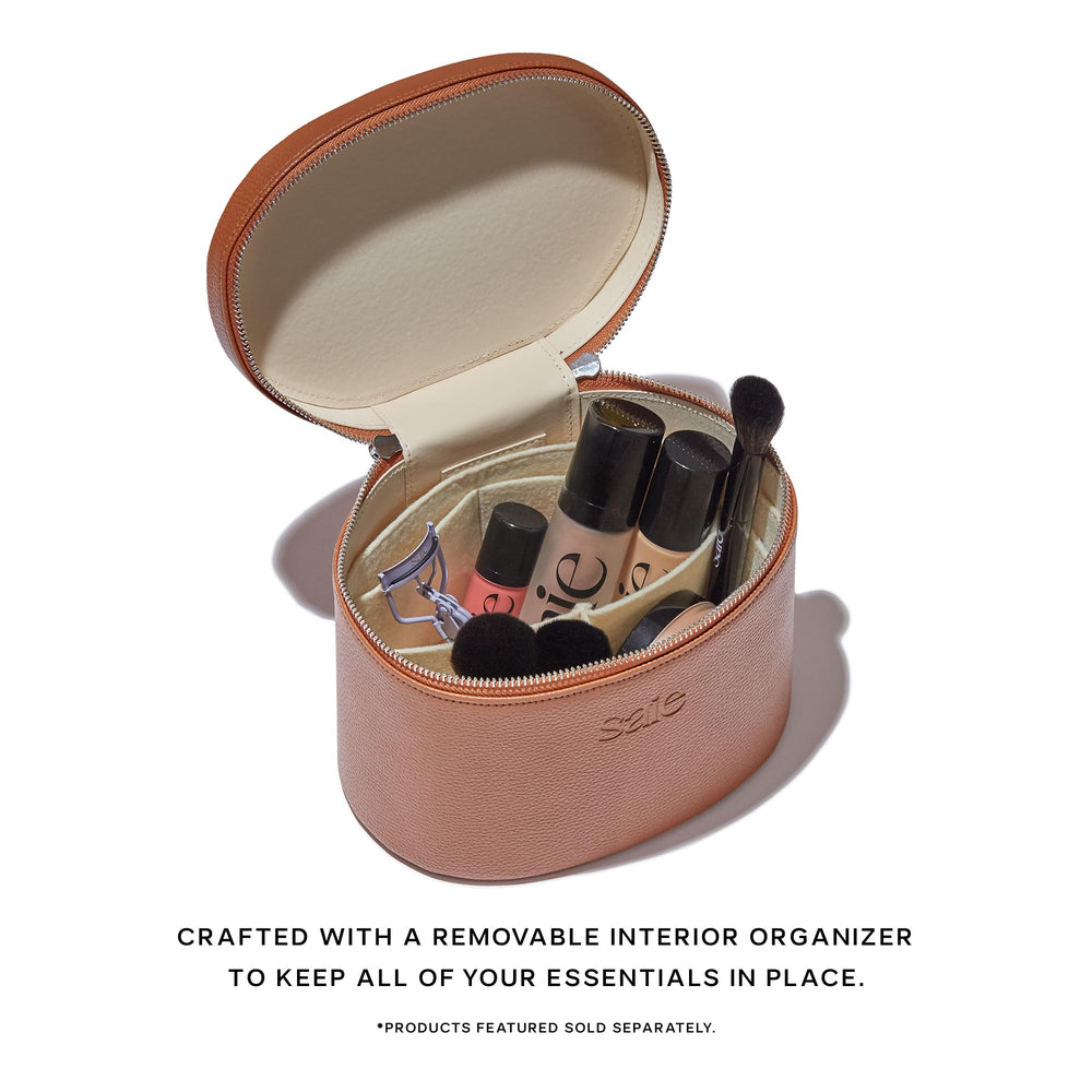 Saie Vanity Case open with removable organizer displaying tidy makeup and skincare storage