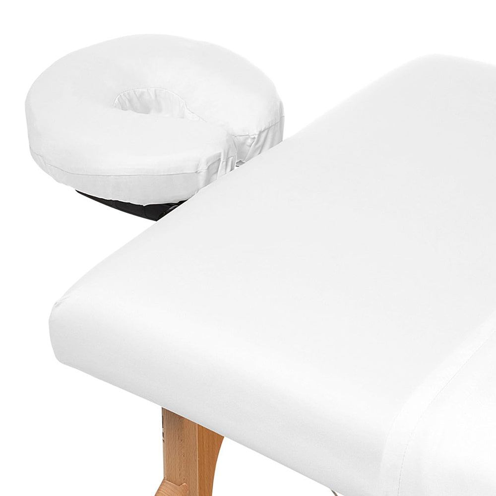Saloniture flat sheet spread across massage table offering full coverage