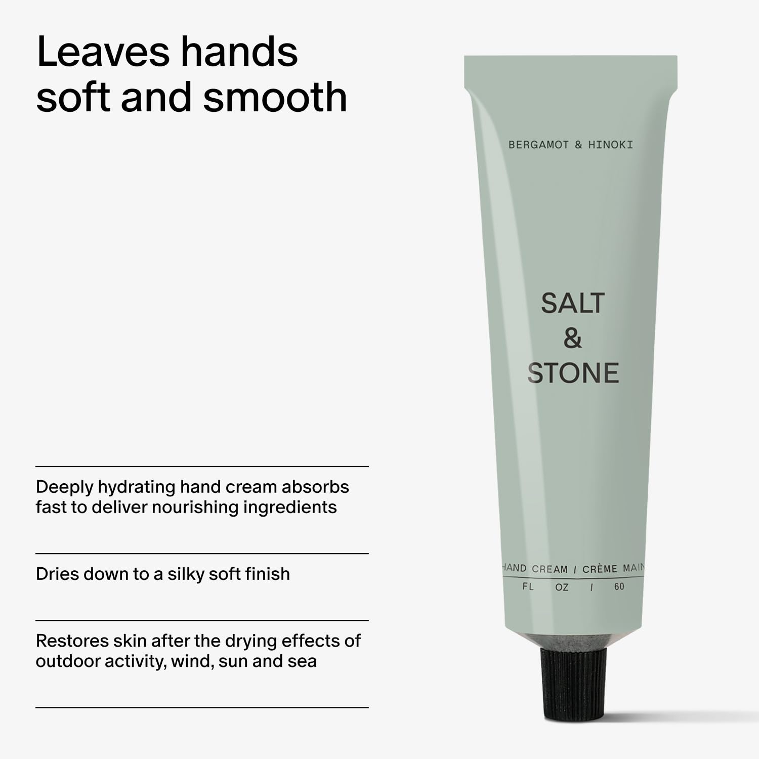 Salt & Stone next to a smartphone to show 2 fl oz size and portability benefit