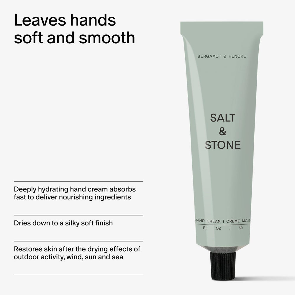 Salt & Stone next to a smartphone to show 2 fl oz size and portability benefit