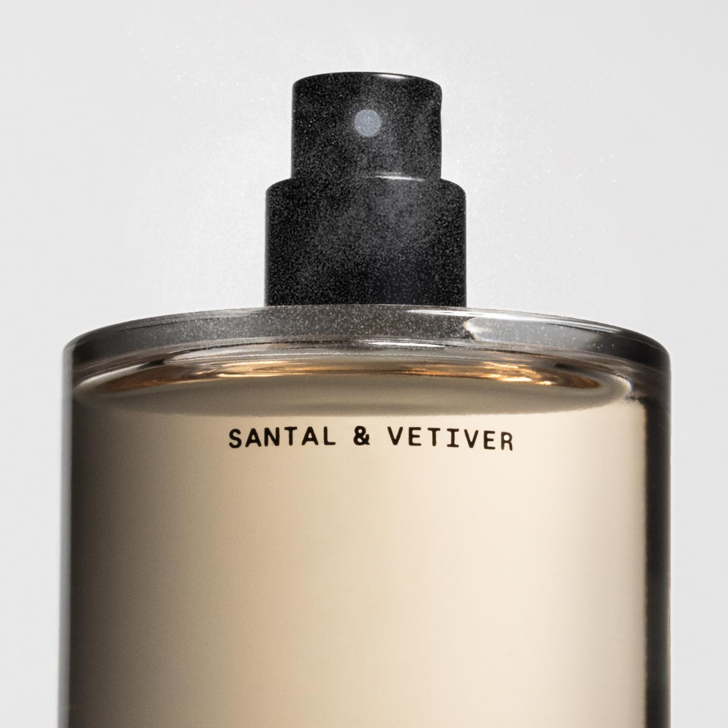 Flat lay of ingredients with Salt & Stone label highlighting sandalwood, vetiver and clean formulation.