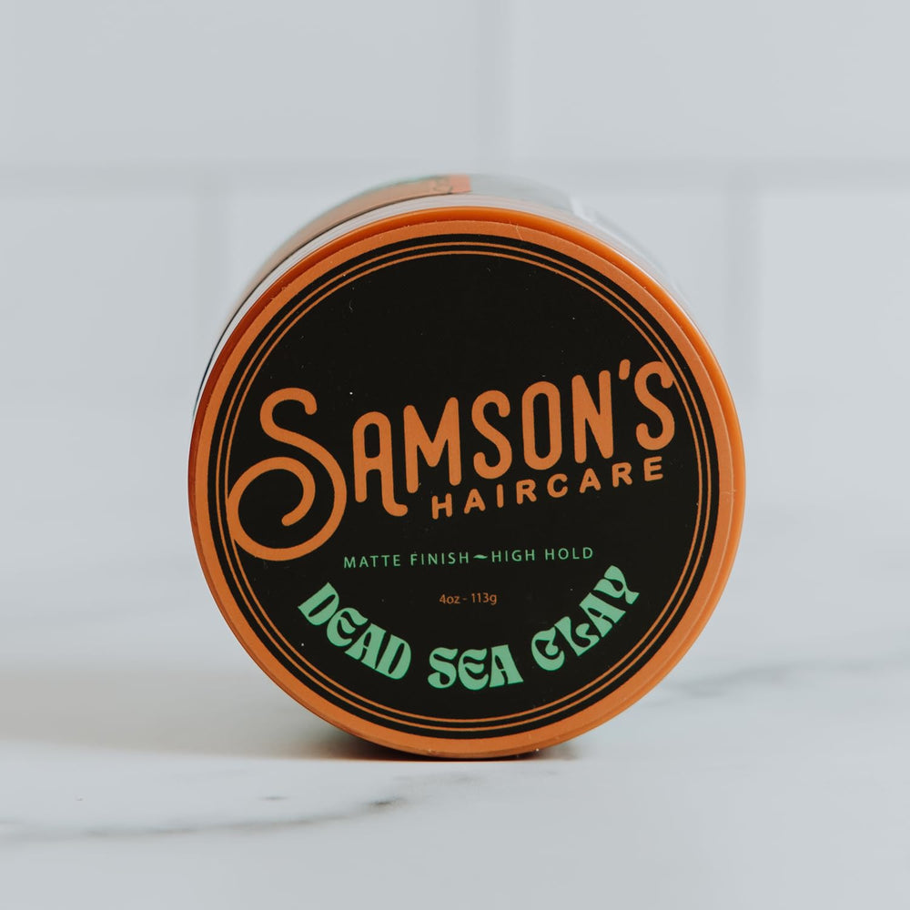 SAMSON'S HAIRCARE open jar close-up showing clay texture and pliability