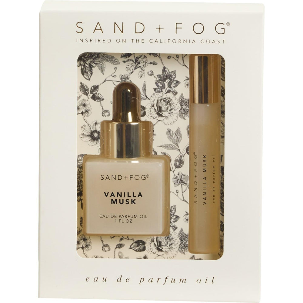 Sand + Fog front packaging showing navy bottle and gold dropper, elegant gift presentation