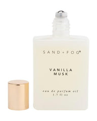 Sand + Fog rollerball close-up on wrist demonstrating precise, mess-free application
