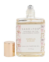 Sand + Fog rollerball held in hand demonstrating precise application and portability