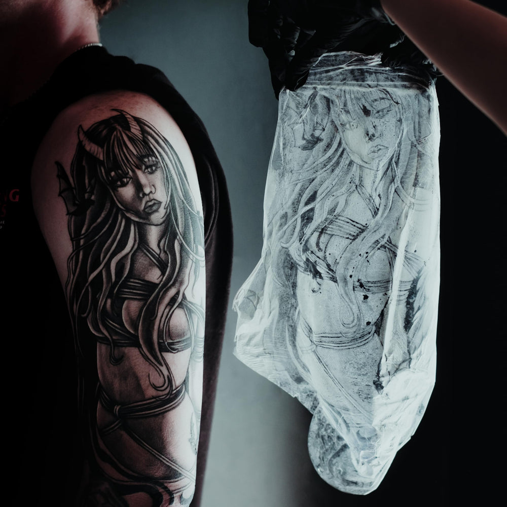 Saniderm in a tattoo studio lifestyle scene showing professional aftercare use