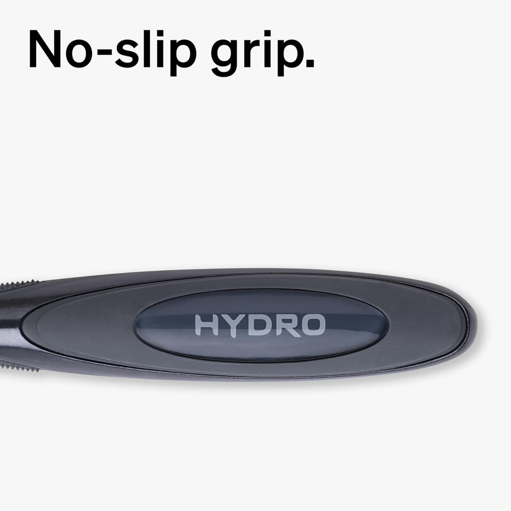Schick Hydro razor in use on wet face demonstrating smooth glide