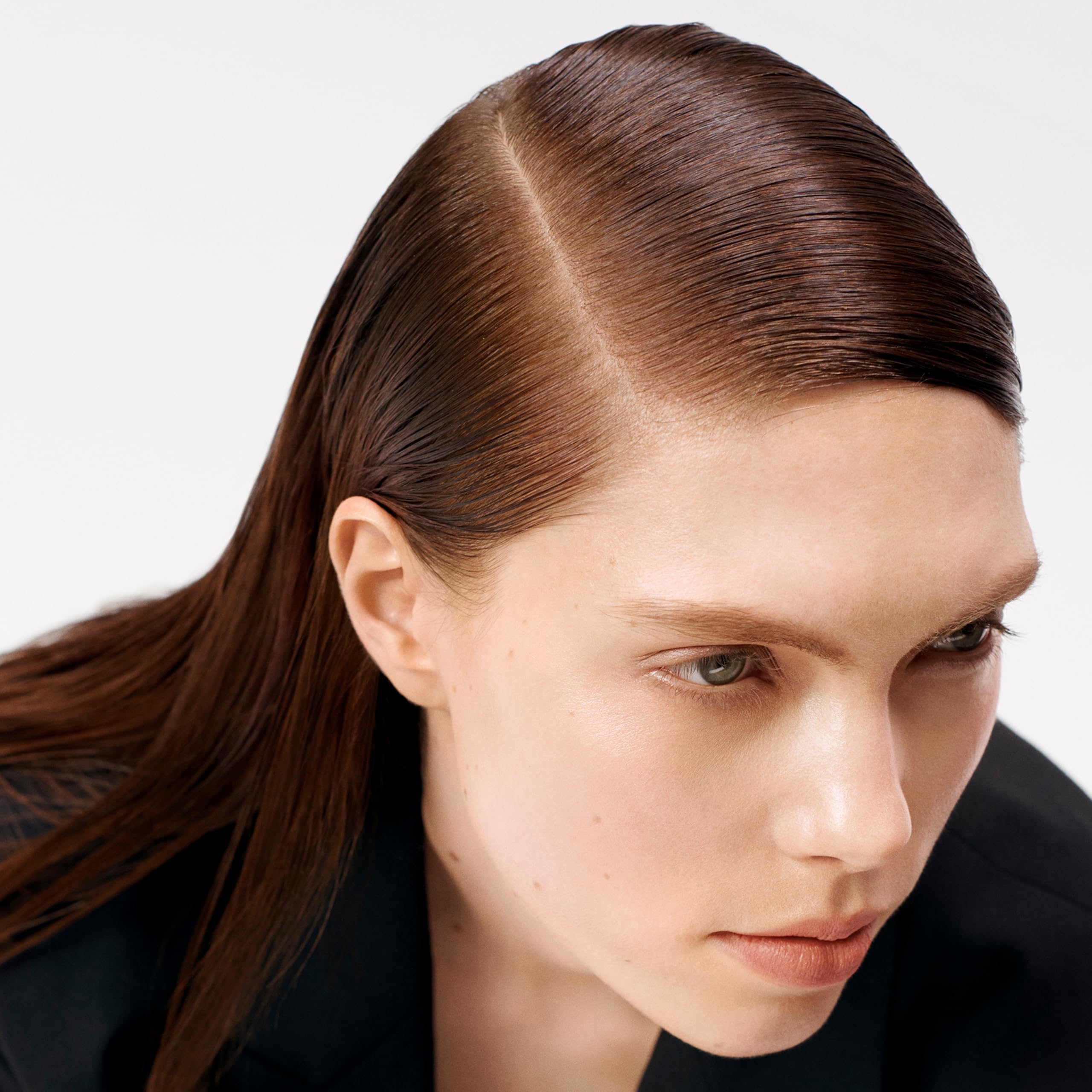 Sebastian Professional clear finish on hair strand showing flake-free look
