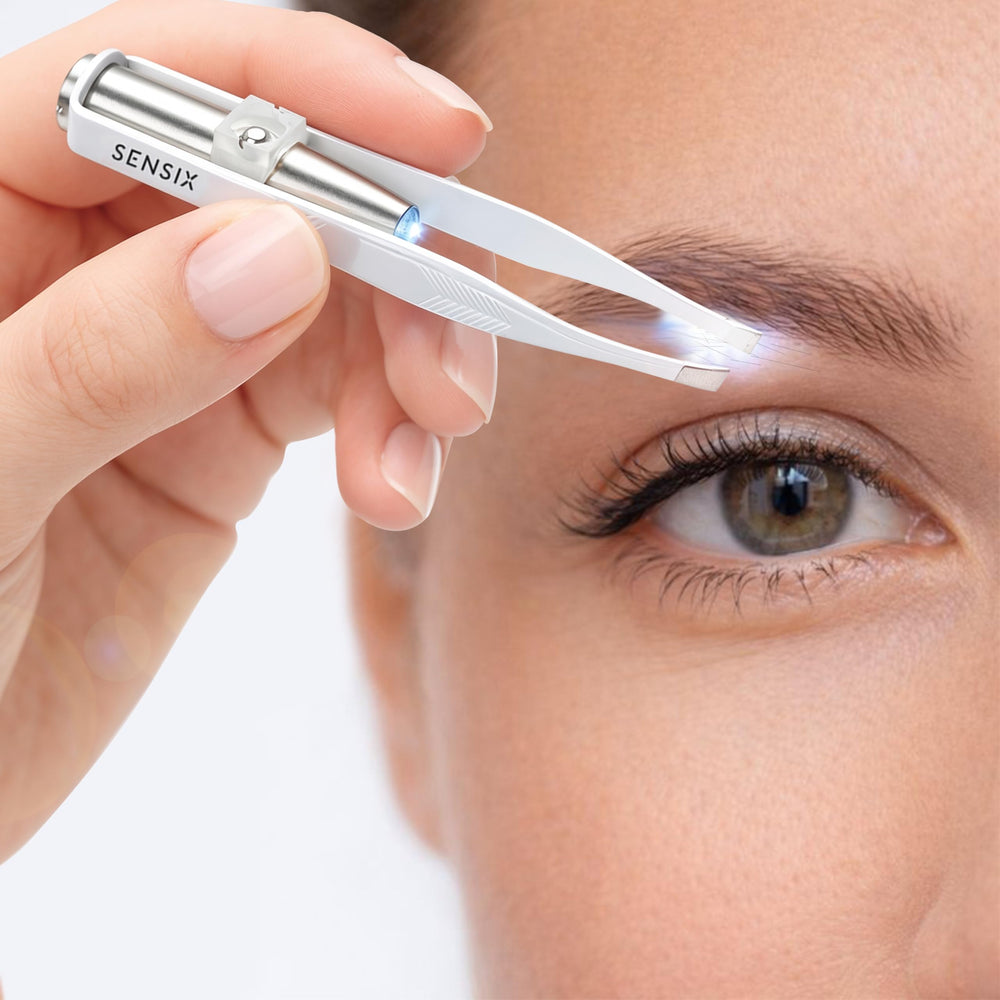 Sensica tweezers beside a ruler to show compact travel-friendly size