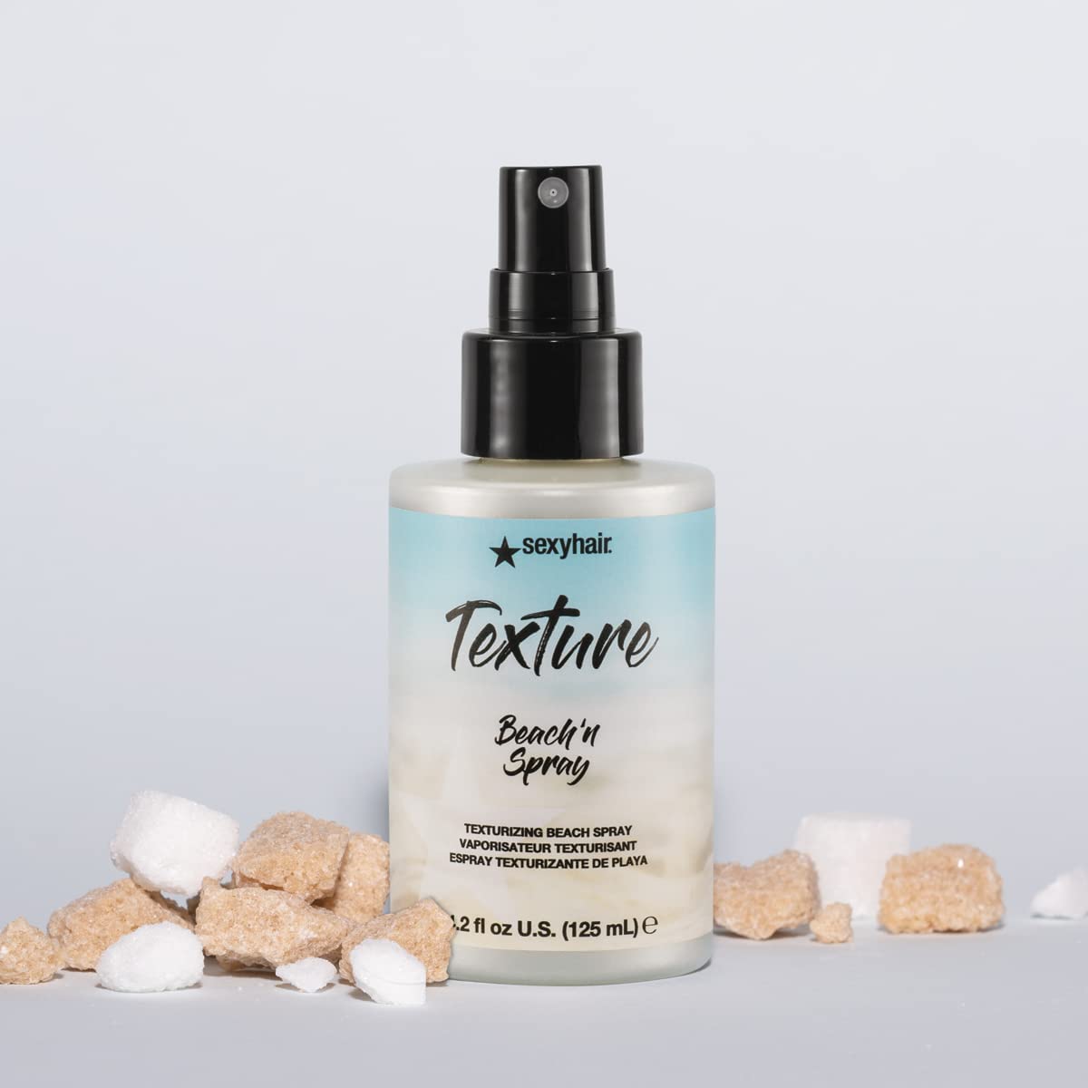 SexyHair bottle in hand illustrating 4.2 oz size for travel and daily use