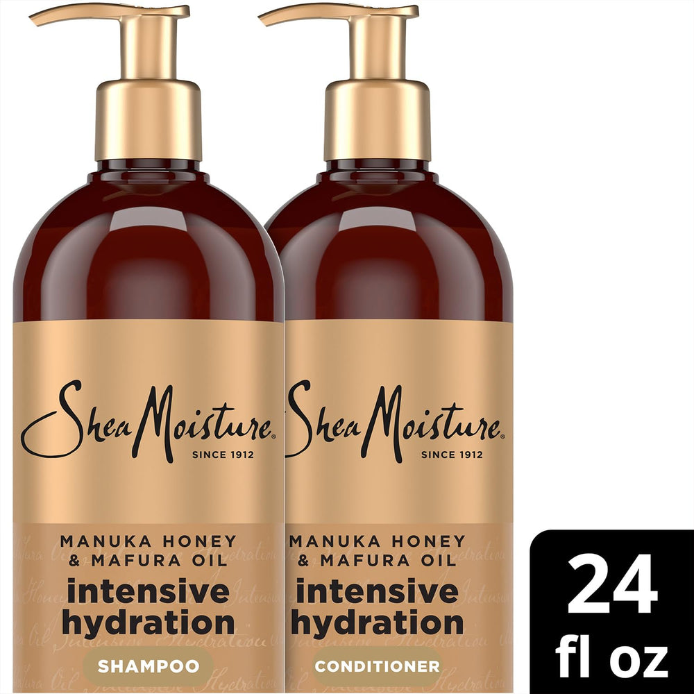 SheaMoisture conditioner detangling curly hair in hands to show improved manageability benefit