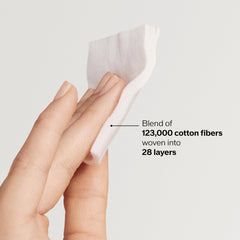 shiseido cotton pad applying softener to cheek for even product distribution