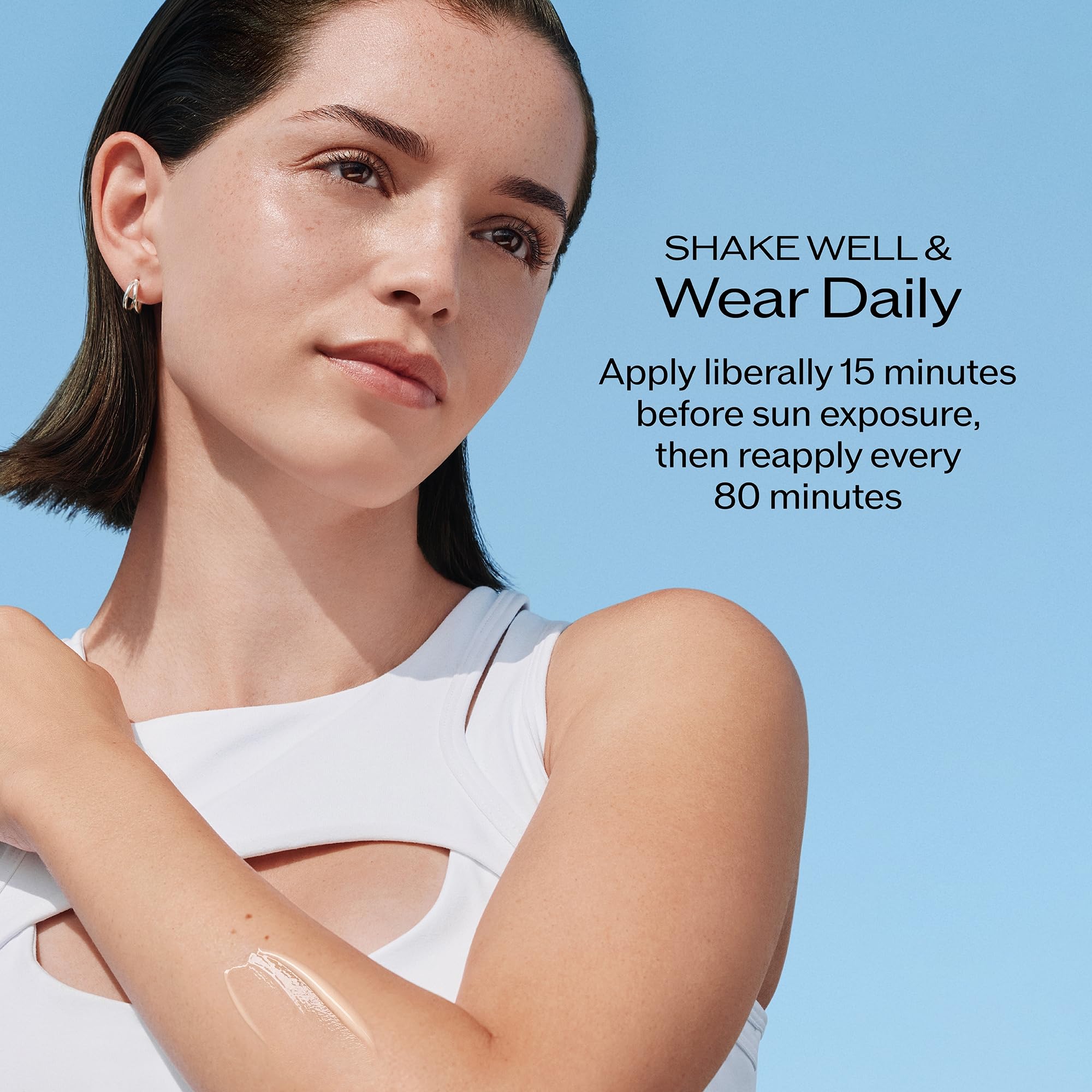 Shiseido sunscreen resisting water spray demonstrating durable, sweat-resistant protection