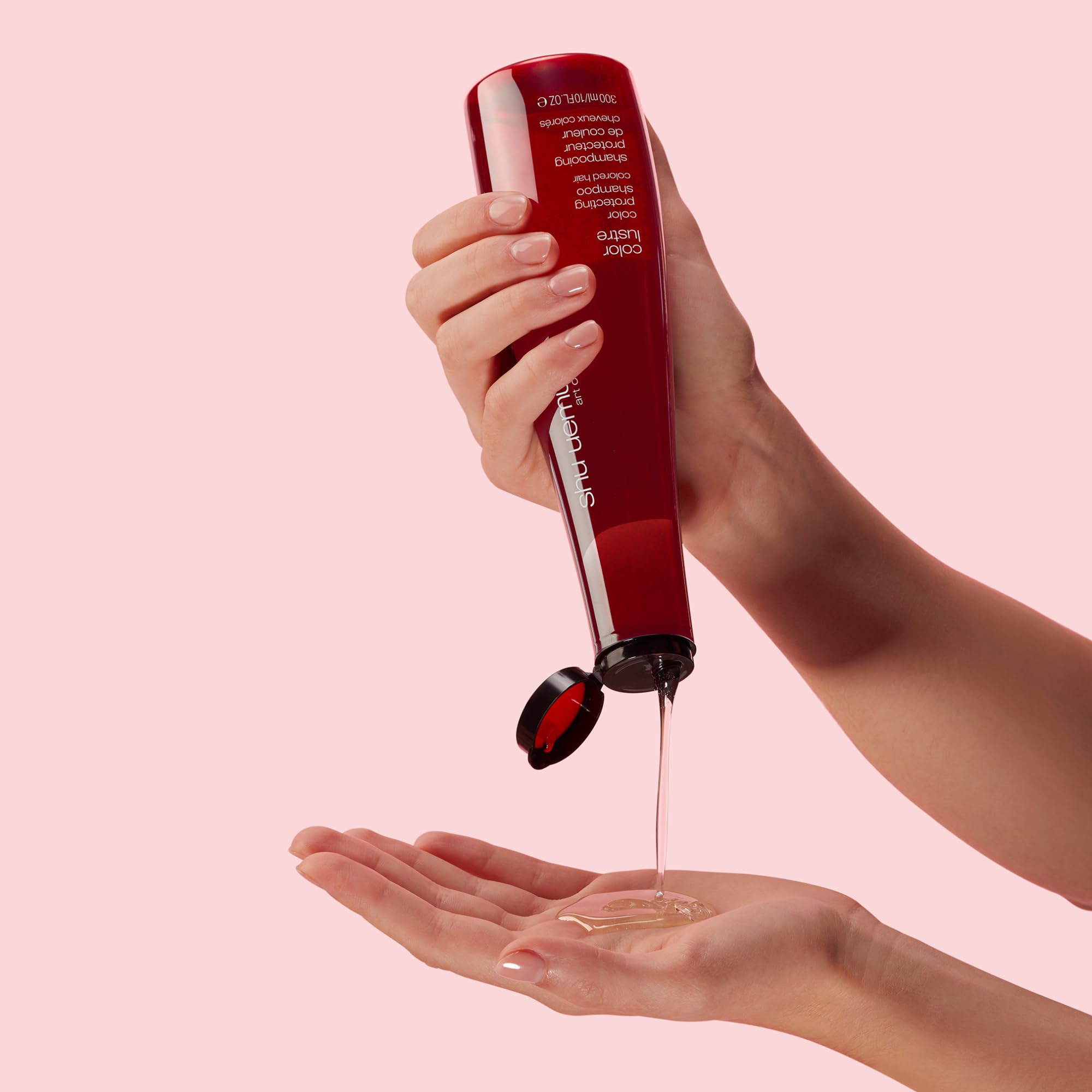 shu uemura bottle on bathroom shelf suggesting salon-care routine