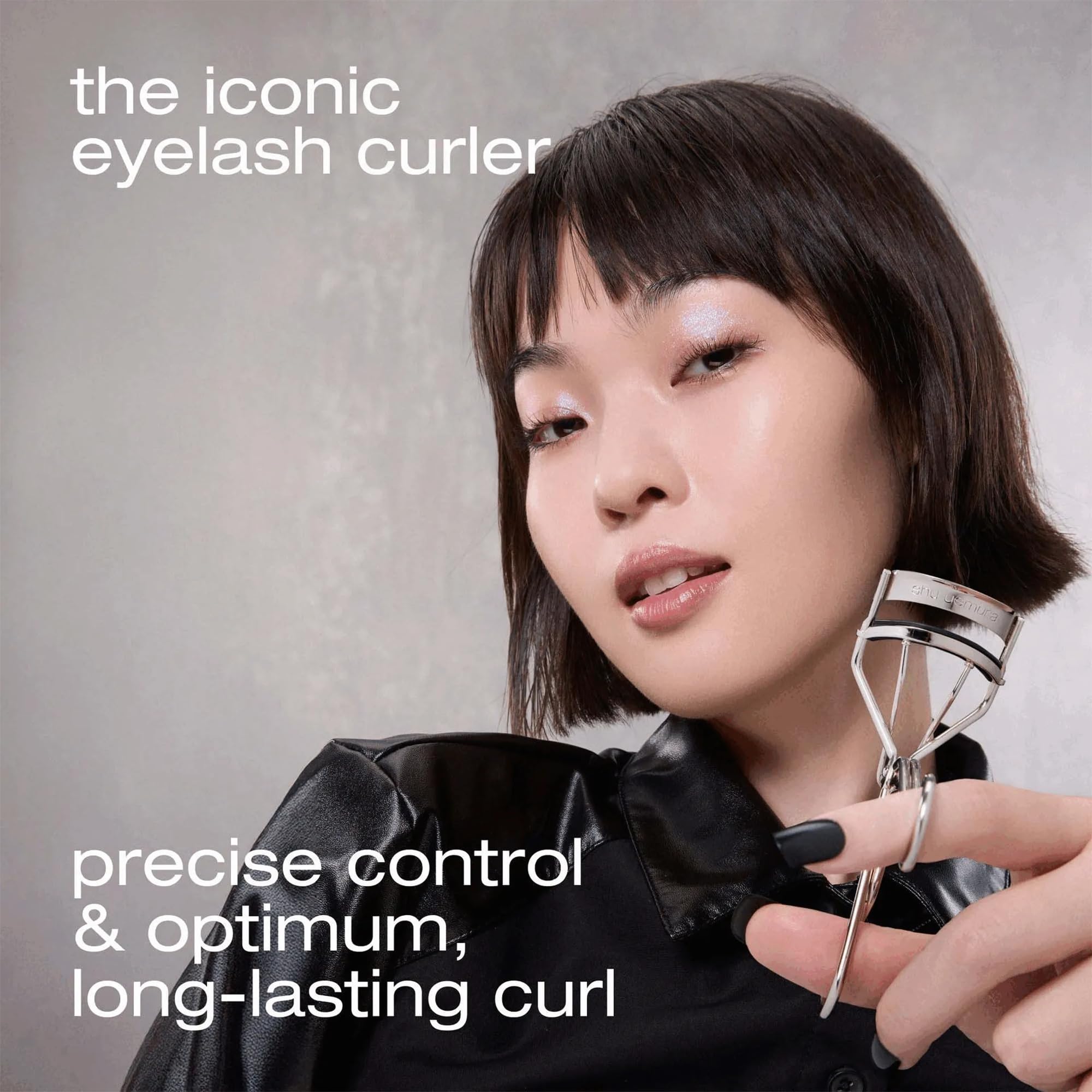shu uemura curler held in hand showing size and easy maneuverability benefit