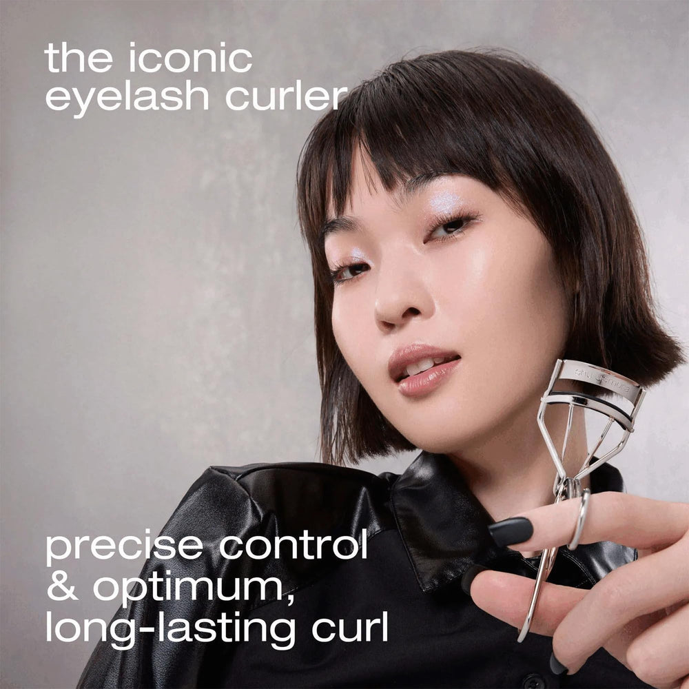 shu uemura curler held in hand showing size and easy maneuverability benefit