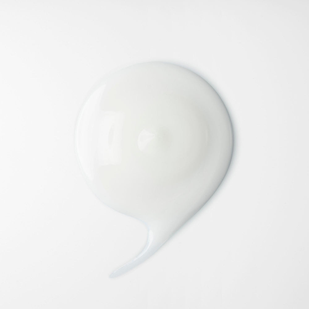 shu uemura art of hair applying cream on towel-dried hair for protection