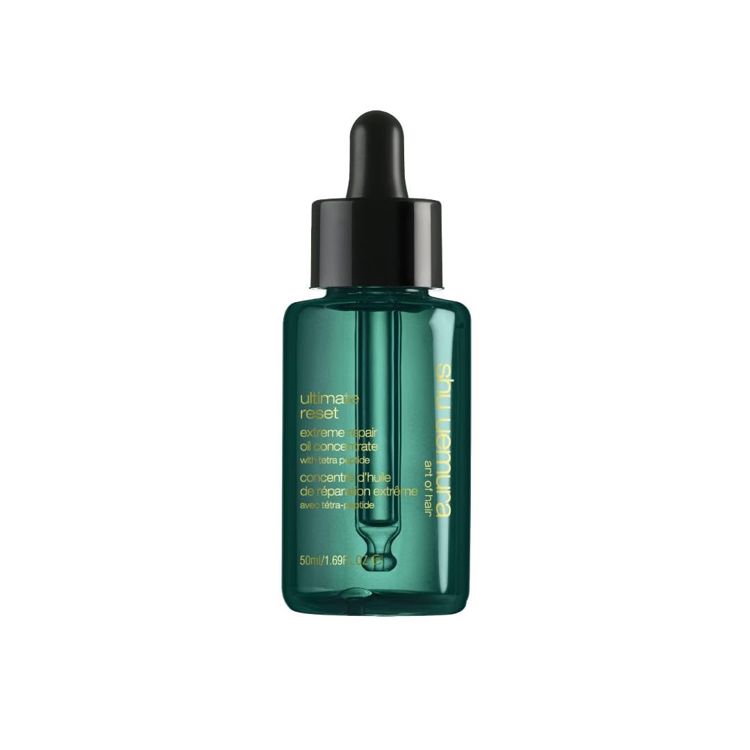 shu uemura art of hair bottle front view showing sleek repair oil packaging and clarity