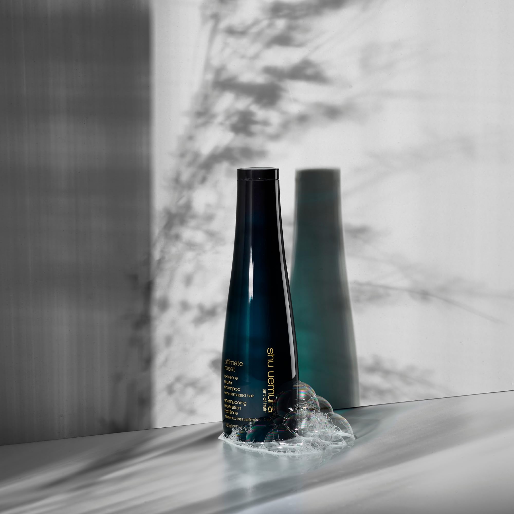 shu uemura shampoo in bathroom scene showing salon-quality routine benefit