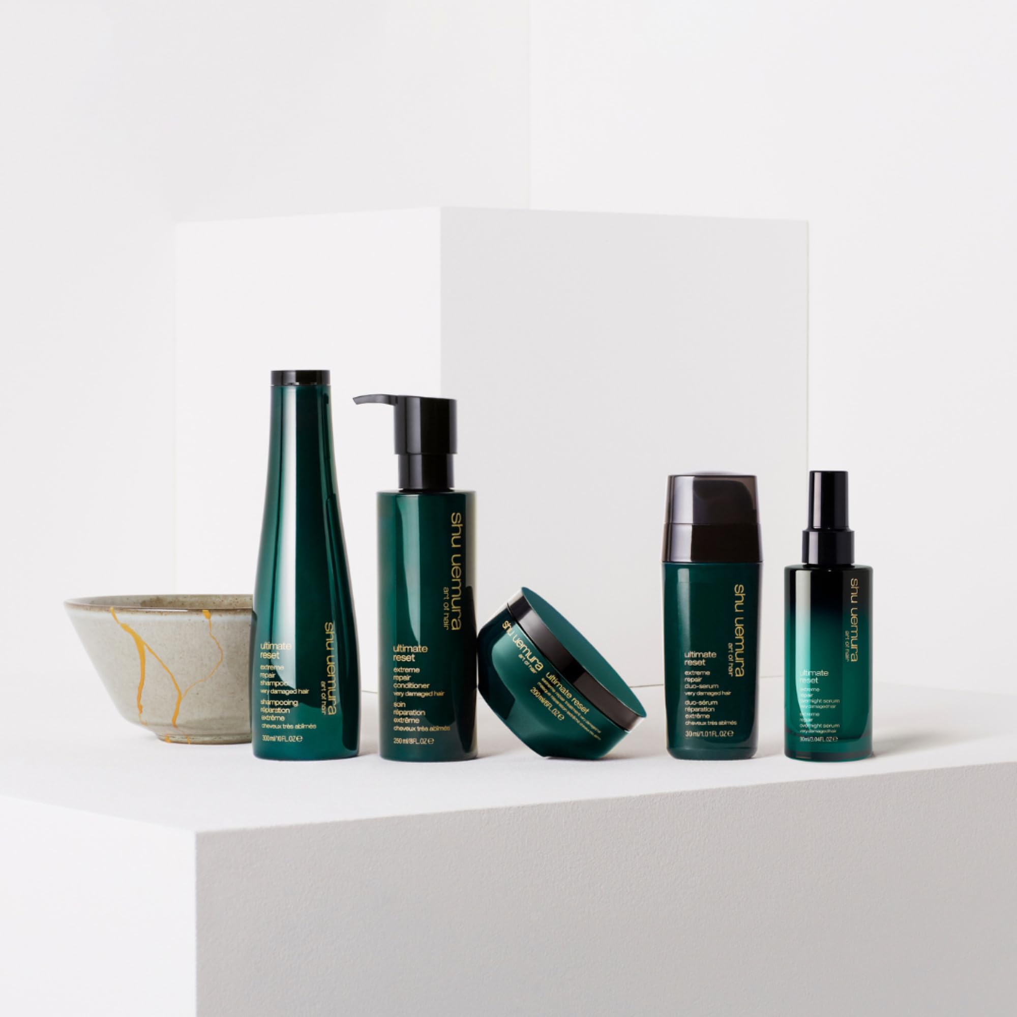 shu uemura conditioner on bathroom shelf in lifestyle setting for salon care at home