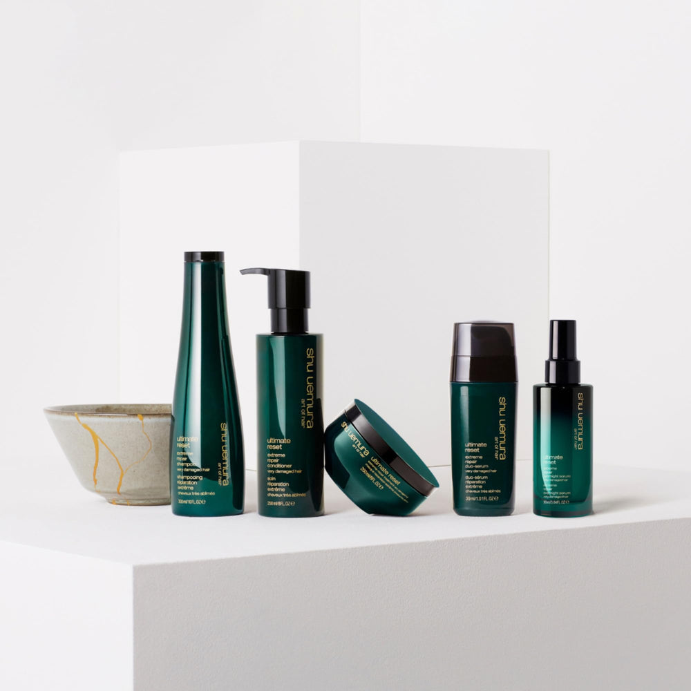 shu uemura conditioner on bathroom shelf in lifestyle setting for salon care at home