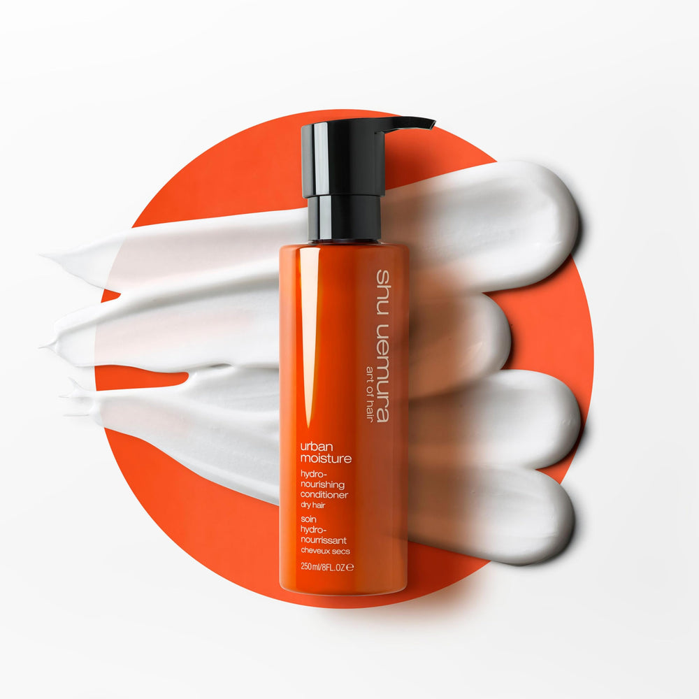 shu uemura art of hair next to a ruler showing 8 fl oz scale for travel-friendly size