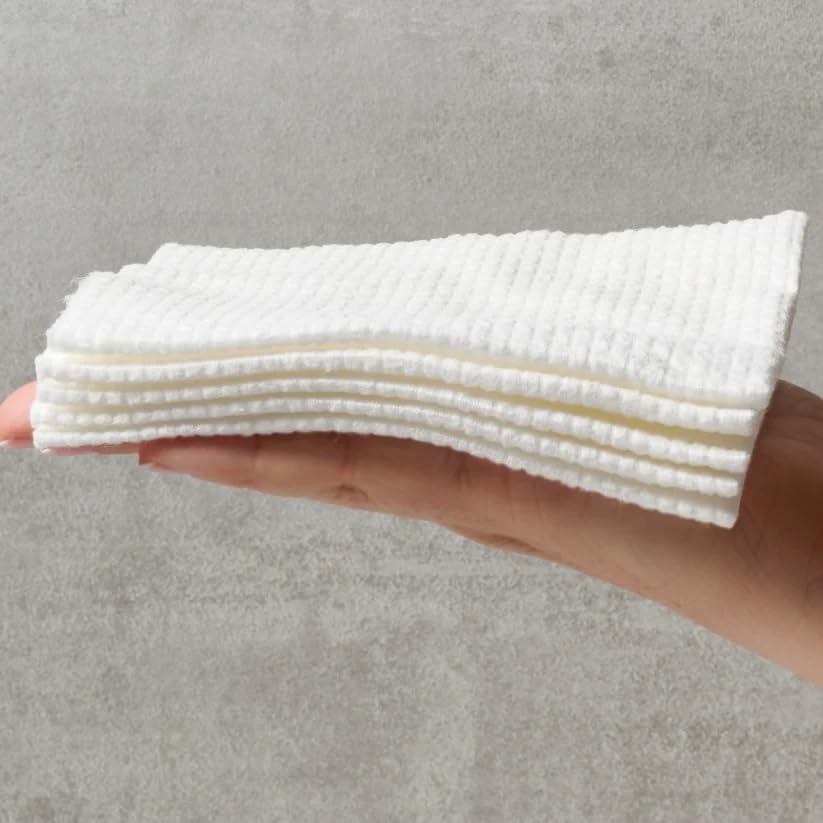 SIMA towel wet with cleanser demonstrating gentle exfoliation and cleansing