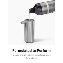 simplehuman bottle held beside hand to show 30 fl oz size and refill value