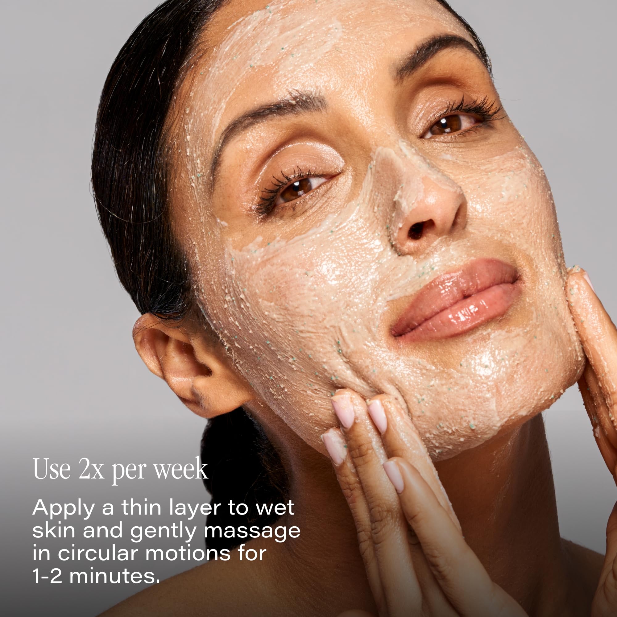 SKINN DermAppeal cream texture on fingers showing gentle scrub action