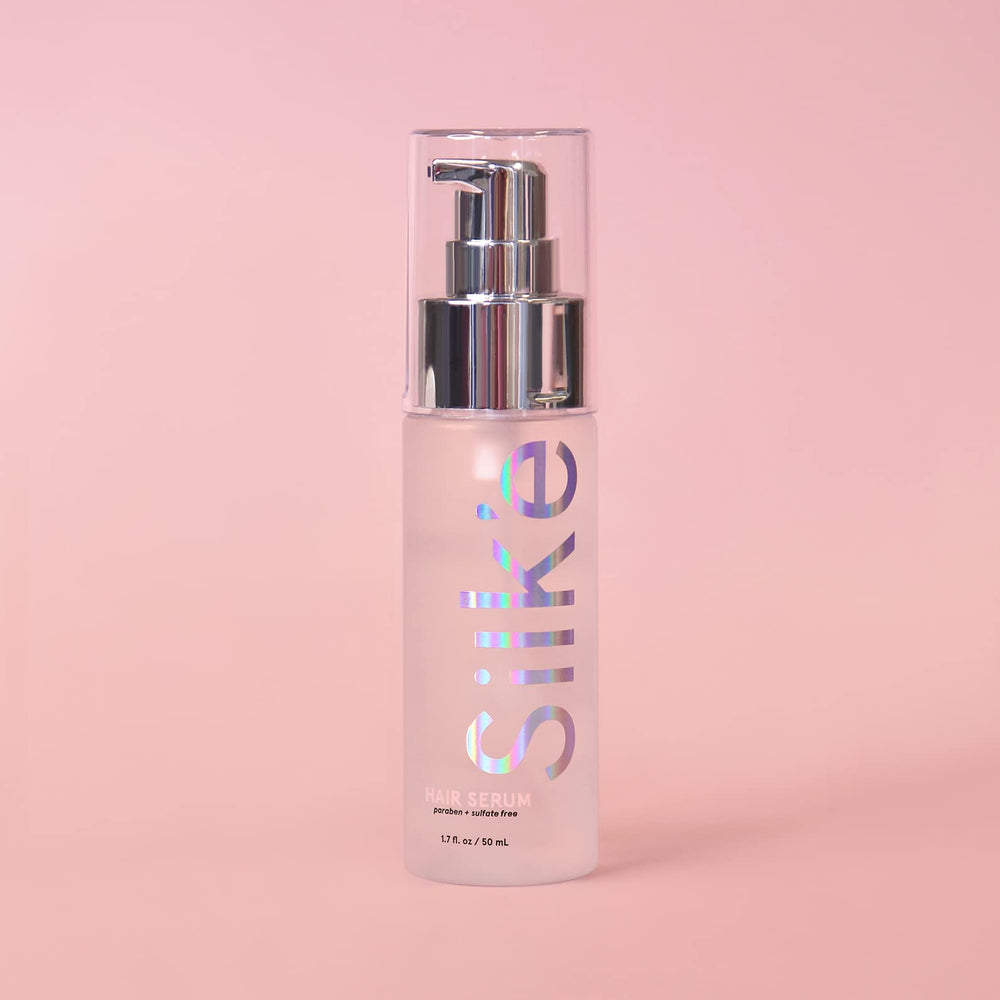 Sleek'e serum texture drop on finger showing lightweight, non-greasy sheen