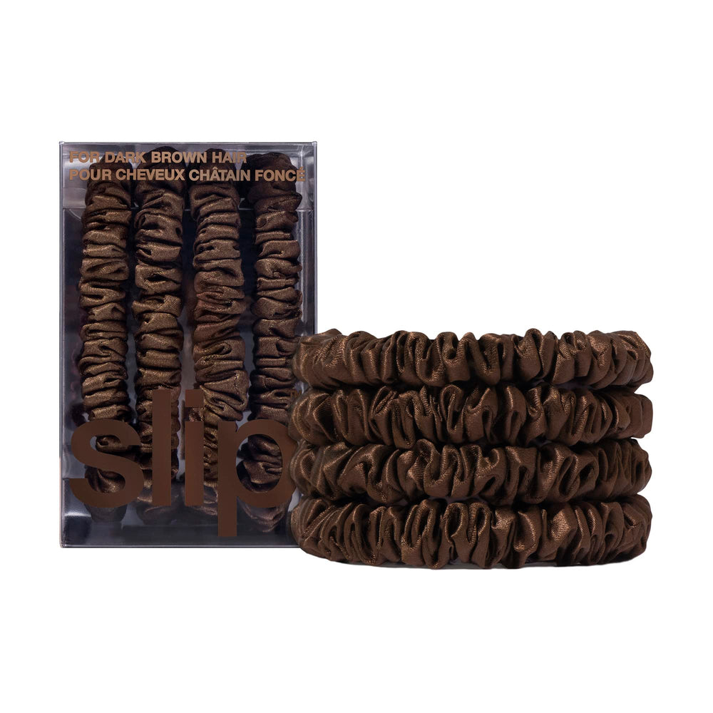 SLIP front packaging showing four dark brown skinny silk scrunchies and benefits
