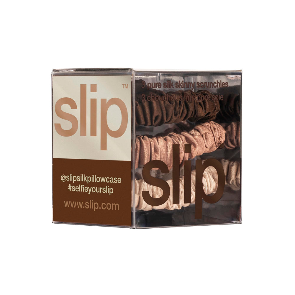 SLIP silk scrunchie beside standard elastic showing gentle pressure advantage
